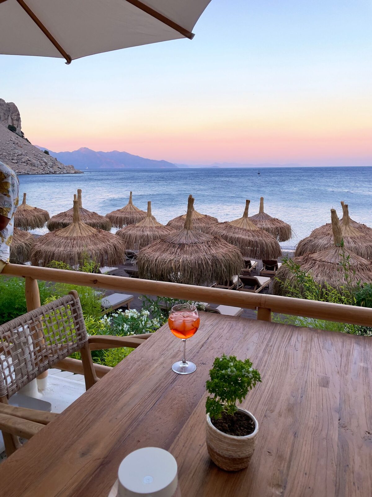Terrace table set for sundowners overlooking the Andaman Sea